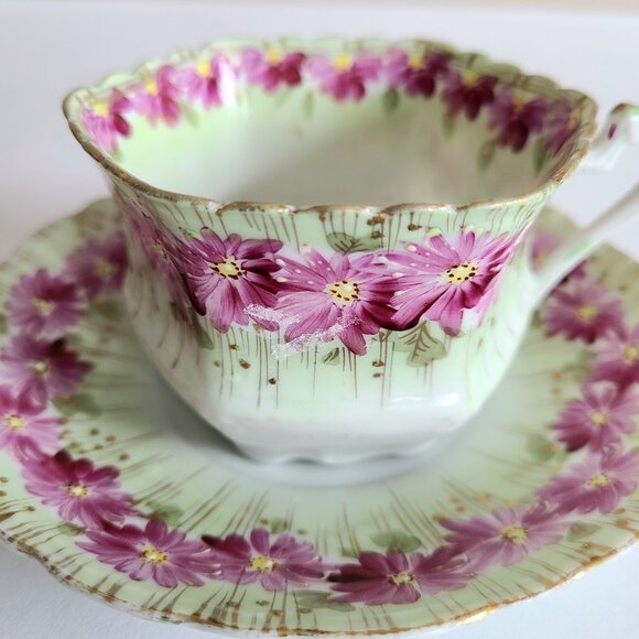 Antique porcelain tea cup with saucer with pink floral design and gold trim. - Picture 3 of 13